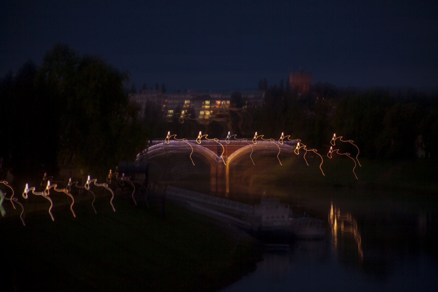 Night view with light trails over a bridge